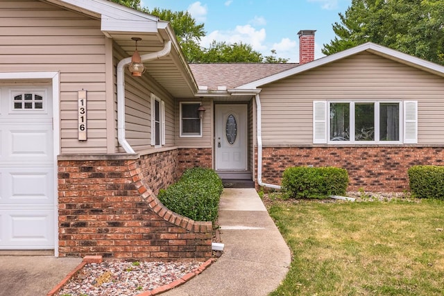 1316 Kirkwood Dr, Pontiac, IL 61764 - doorway to property with brick siding, a chimney, a yard, and a shingled roof