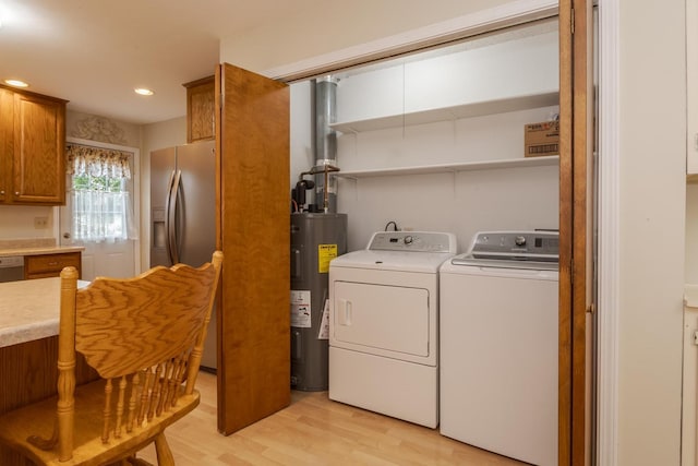 1316 Kirkwood Dr, Pontiac, IL 61764 - washroom featuring electric water heater, washer and clothes dryer, light wood-style floors, and recessed lighting