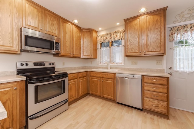 1316 Kirkwood Dr, Pontiac, IL 61764 - kitchen featuring appliances with stainless steel finishes, light wood-type flooring, light countertops, and recessed lighting