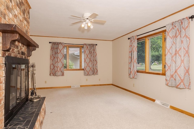 1316 Kirkwood Dr, Pontiac, IL 61764 - unfurnished living room featuring carpet flooring, crown molding, a ceiling fan, and a large fireplace