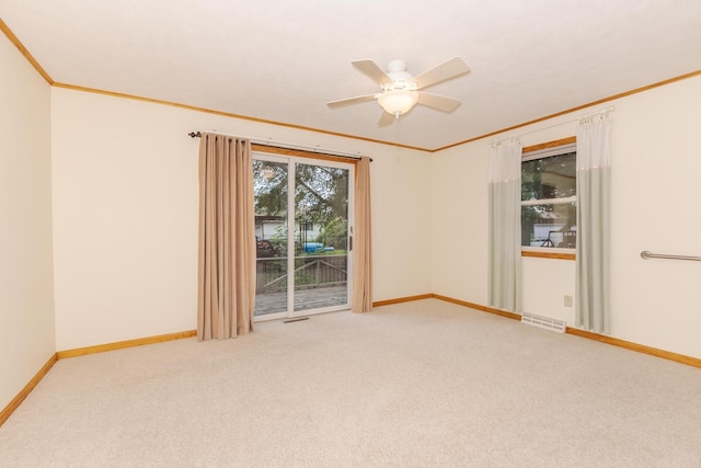1316 Kirkwood Dr, Pontiac, IL 61764 - carpeted spare room featuring ornamental molding and a ceiling fan