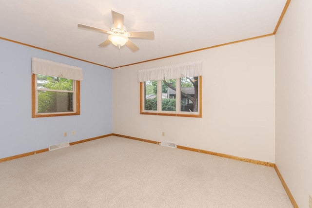 1316 Kirkwood Dr, Pontiac, IL 61764 - carpeted spare room featuring crown molding, plenty of natural light, and ceiling fan