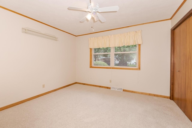 1316 Kirkwood Dr, Pontiac, IL 61764 - unfurnished bedroom with carpet flooring, crown molding, a closet, and a ceiling fan