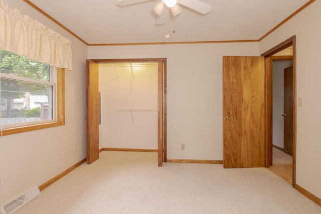 1316 Kirkwood Dr, Pontiac, IL 61764 - unfurnished bedroom with ornamental molding, a closet, carpet flooring, and ceiling fan