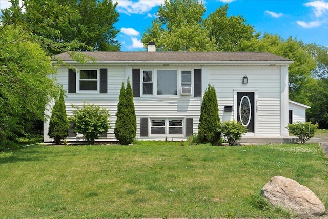 2116 Castle Ct, Waukegan, IL 60087 - split foyer home with a front lawn and a chimney