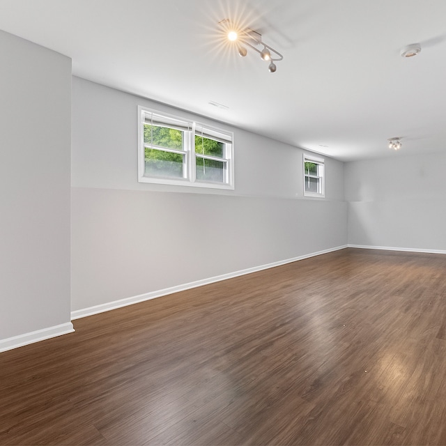 2116 Castle Ct, Waukegan, IL 60087 - unfurnished room featuring dark wood-style floors and rail lighting
