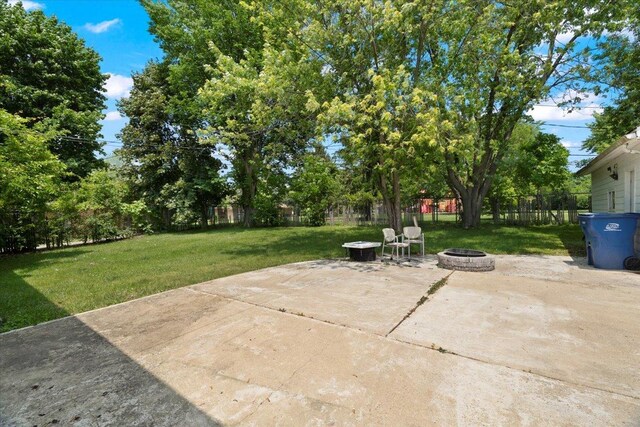 2116 Castle Ct, Waukegan, IL 60087 - fenced backyard with a fire pit and a patio area