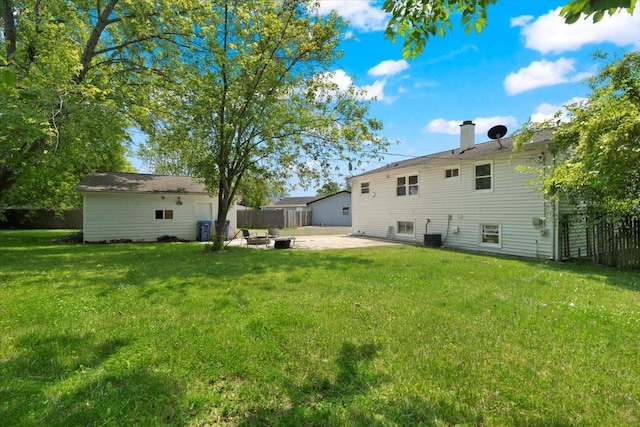 2116 Castle Ct, Waukegan, IL 60087 - rear view of house with a patio and a chimney