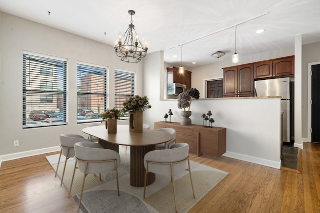 7438 N Hermitage Ave Unit 1E, Chicago, IL 60626 - dining space featuring recessed lighting, light wood-style flooring, and a chandelier