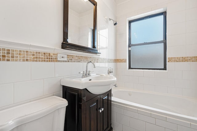 7438 N Hermitage Ave Unit 1E, Chicago, IL 60626 - bathroom featuring tiled tub, tile walls, and vanity