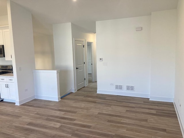 939 Saddle Ridge Dr, Joliet, IL 60432 - empty room with wood finished floors and baseboards