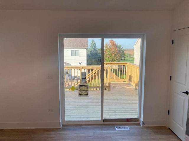 939 Saddle Ridge Dr, Joliet, IL 60432 - doorway with baseboards and wood finished floors