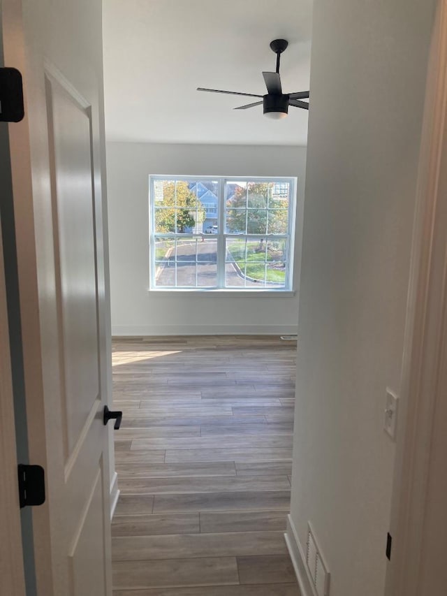 939 Saddle Ridge Dr, Joliet, IL 60432 - corridor with wood finished floors and baseboards