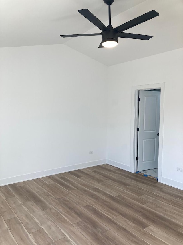 939 Saddle Ridge Dr, Joliet, IL 60432 - spare room with wood finished floors, a ceiling fan, and lofted ceiling