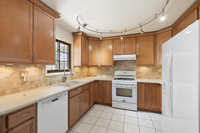 16492 Brockton Ln, Oak Forest, IL 60452 - kitchen featuring white appliances, under cabinet range hood, light countertops, and brown cabinets