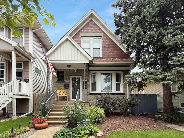 1140 S Harvey Ave, Oak Park, IL 60304 - view of front facade with board and batten siding, stone siding, and stairs