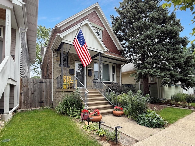 1140 S Harvey Ave, Oak Park, IL 60304 - view of front facade with stone siding, brick siding, and a porch