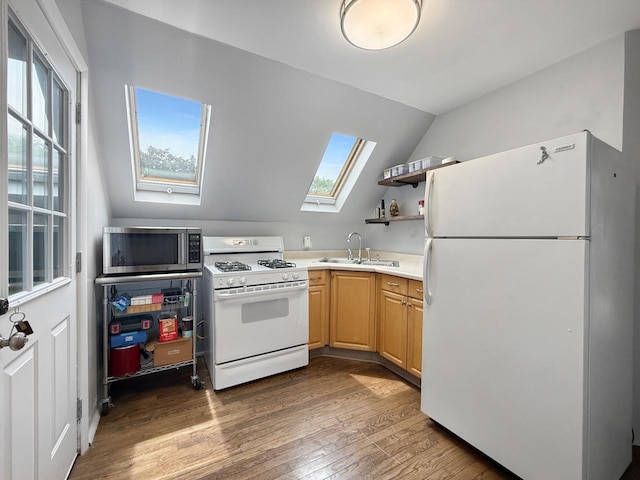 1140 S Harvey Ave, Oak Park, IL 60304 - kitchen featuring white appliances, a skylight, hardwood / wood-style floors, vaulted ceiling, and light brown cabinetry