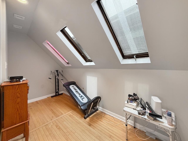 1140 S Harvey Ave, Oak Park, IL 60304 - workout area featuring a skylight, lofted ceiling, and wood-type flooring