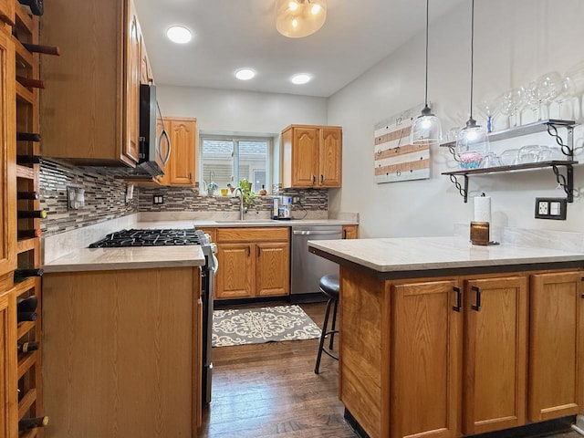 1140 S Harvey Ave, Oak Park, IL 60304 - kitchen featuring stainless steel appliances, light countertops, decorative backsplash, and dark wood-type flooring