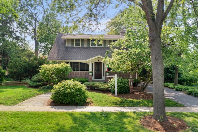 4416 Seeley Ave, Downers Grove, IL 60515 - view of front of home featuring a front lawn, roof with shingles, and a chimney