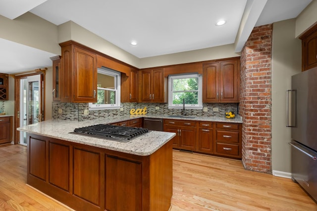 4416 Seeley Ave, Downers Grove, IL 60515 - kitchen featuring appliances with stainless steel finishes, a peninsula, light wood-style floors, tasteful backsplash, and recessed lighting