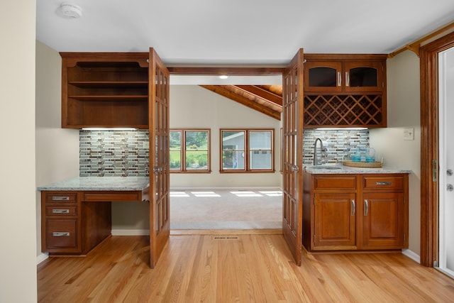 4416 Seeley Ave, Downers Grove, IL 60515 - indoor wet bar with light wood-type flooring and backsplash