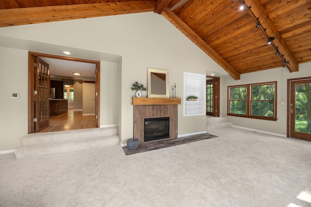 4416 Seeley Ave, Downers Grove, IL 60515 - unfurnished living room with a wooden ceiling with exposed beams, track lighting, carpet floors, a fireplace with flush hearth, and high vaulted ceiling
