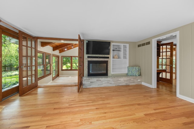4416 Seeley Ave, Downers Grove, IL 60515 - unfurnished living room featuring french doors, wood finished floors, and a large fireplace