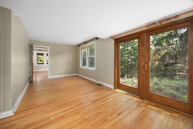 4416 Seeley Ave, Downers Grove, IL 60515 - empty room with light wood-type flooring and plenty of natural light