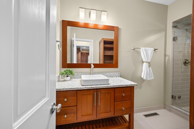 4416 Seeley Ave, Downers Grove, IL 60515 - bathroom featuring tiled shower, vanity, and tile patterned floors
