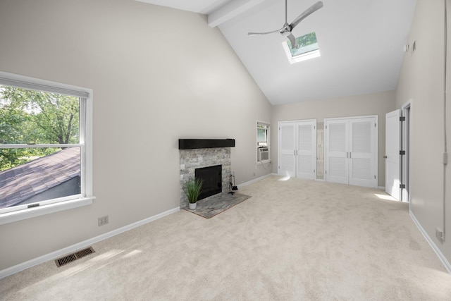 4416 Seeley Ave, Downers Grove, IL 60515 - unfurnished living room with high vaulted ceiling, a skylight, plenty of natural light, carpet floors, and beam ceiling