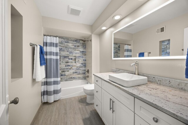 4416 Seeley Ave, Downers Grove, IL 60515 - bathroom featuring vanity, wood finished floors, recessed lighting, and shower / bath combination with curtain