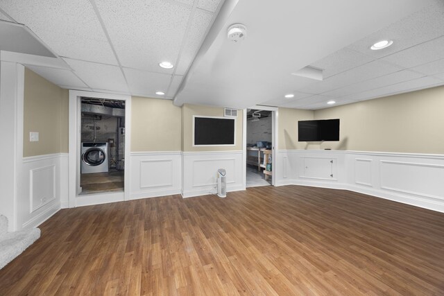 4416 Seeley Ave, Downers Grove, IL 60515 - unfurnished living room featuring washer / dryer, a paneled ceiling, wood finished floors, wainscoting, and recessed lighting