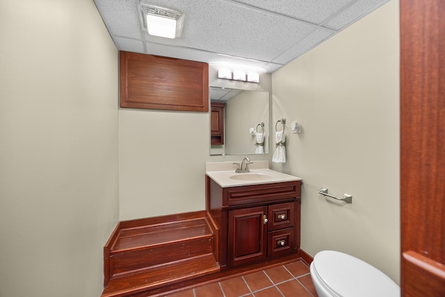 4416 Seeley Ave, Downers Grove, IL 60515 - half bathroom featuring a drop ceiling, vanity, and tile patterned floors