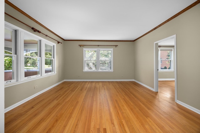 4416 Seeley Ave, Downers Grove, IL 60515 - spare room featuring crown molding and light wood-style floors