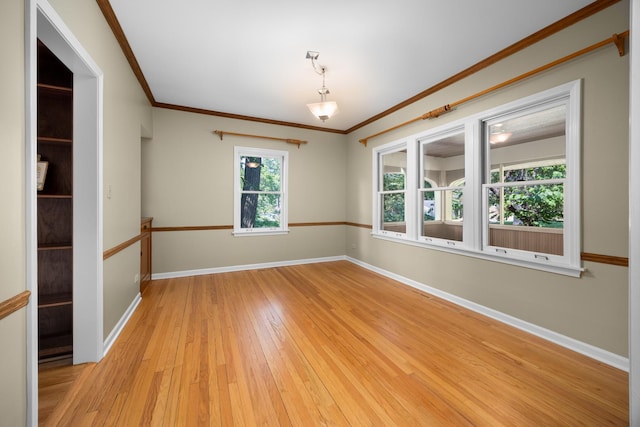 4416 Seeley Ave, Downers Grove, IL 60515 - empty room featuring light wood-type flooring and ornamental molding