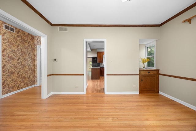 4416 Seeley Ave, Downers Grove, IL 60515 - spare room with light wood finished floors and ornamental molding