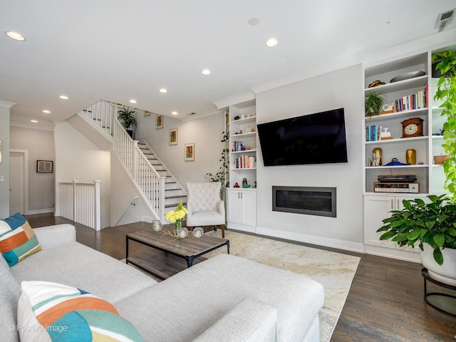 4836 N Damen Ave Unit 3, Chicago, IL 60625 - living area featuring recessed lighting, wood finished floors, stairs, ornamental molding, and a glass covered fireplace