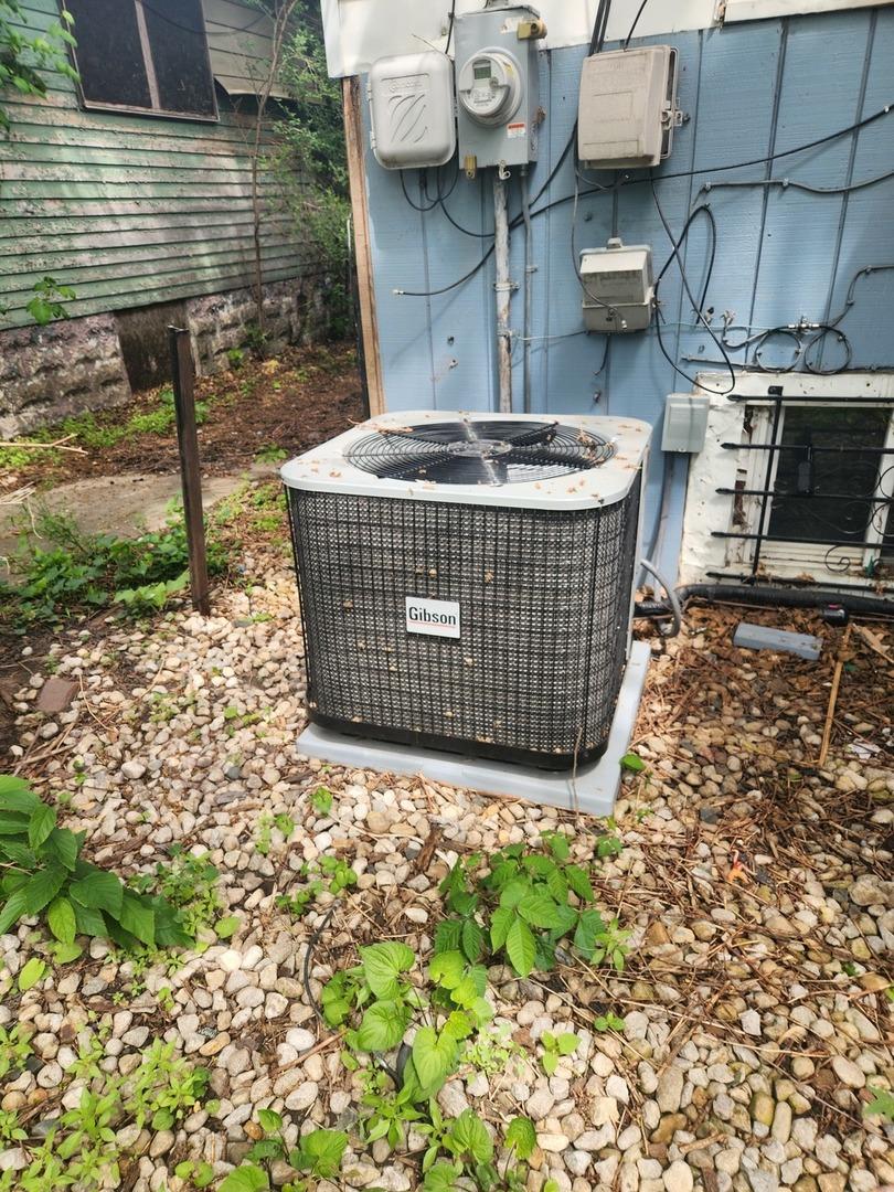 1326 Shields Ave, Chicago Heights, IL 60411 - exterior view of a central air condition unit and electric meter