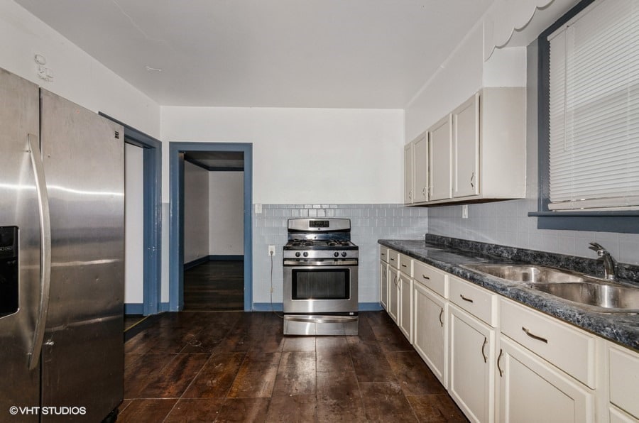 1326 Shields Ave, Chicago Heights, IL 60411 - kitchen featuring appliances with stainless steel finishes, dark wood finished floors, and backsplash