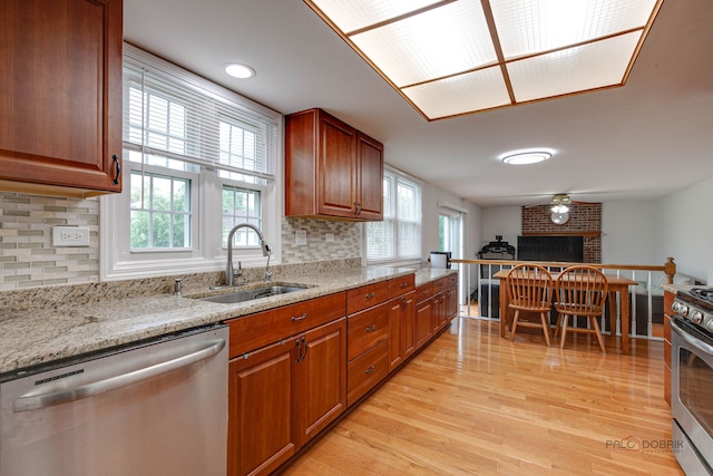 4900 Dukesberry Ln, Hoffman Estates, IL 60010 - kitchen with stainless steel appliances, healthy amount of natural light, light wood-style flooring, and light stone countertops