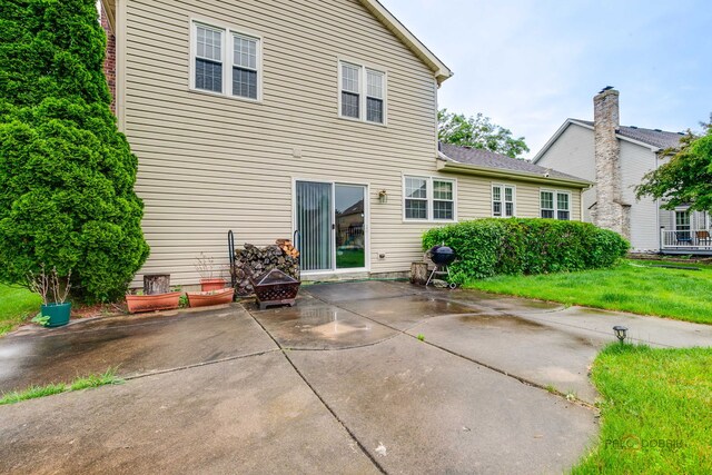4900 Dukesberry Ln, Hoffman Estates, IL 60010 - rear view of property with a patio area and a lawn