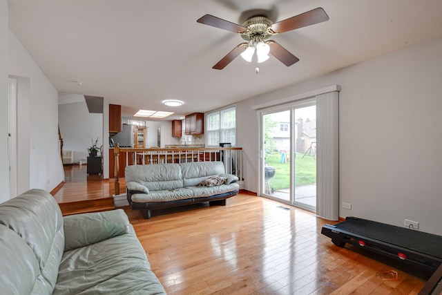 4900 Dukesberry Ln, Hoffman Estates, IL 60010 - living area with light wood-style floors and ceiling fan