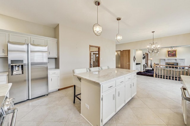 7830 W 157th St, Orland Park, IL 60462 - kitchen featuring stainless steel fridge, stove, light tile patterned floors, and white cabinets