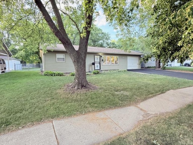 2017 E Sauk Trl, Sauk Village, IL 60411 - ranch-style home with asphalt driveway and a garage