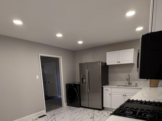 2017 E Sauk Trl, Sauk Village, IL 60411 - kitchen featuring washer / dryer, stainless steel fridge, recessed lighting, light countertops, and white cabinets
