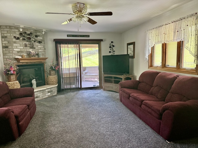 241 E Porter St, Oglesby, IL 61348 - living room with ceiling fan, carpet flooring, and a fireplace