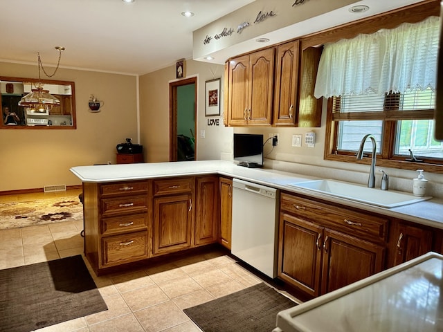 241 E Porter St, Oglesby, IL 61348 - kitchen featuring dishwasher, light tile patterned flooring, brown cabinets, and a peninsula