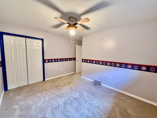 241 E Porter St, Oglesby, IL 61348 - unfurnished bedroom featuring carpet floors, a closet, and ceiling fan